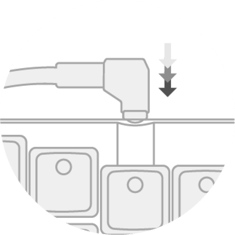 Putting a keycap on the keyswitch, arrows pointing down indicating direction of force