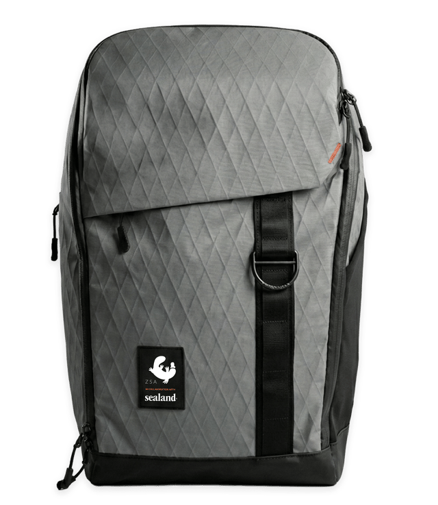 The ZSA Backpack product image alongside the included Nexstand K2 premium laptop stand — your complete ergonomic kit