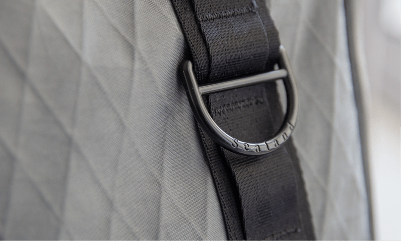 The ZSA Backpack styled in a real-world setting, showcasing its sleek minimalist aesthetic