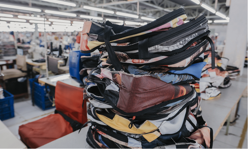 A stack of finished ZSA Backpacks on the factory floor at Tasindo.